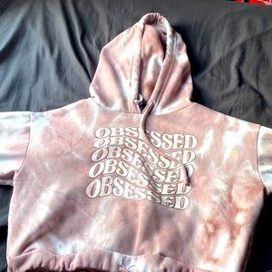 Why would splashes of pink crop top has the words obsessed on it drawstring